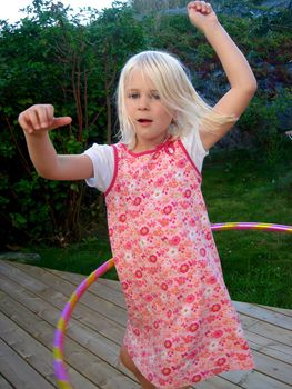 girl playing the hula hoop. Please note: No negative use allowed.