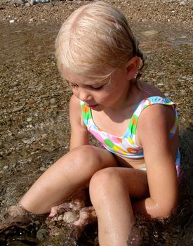 girl sitting on the beach. Please note: No negative use allowed.