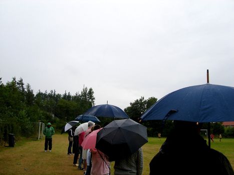 watching a football game in the rain. Please note: No negative use allowed.