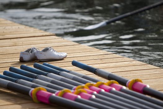 while team Leaving stage for rowing race. A pair of shoe sending them off.