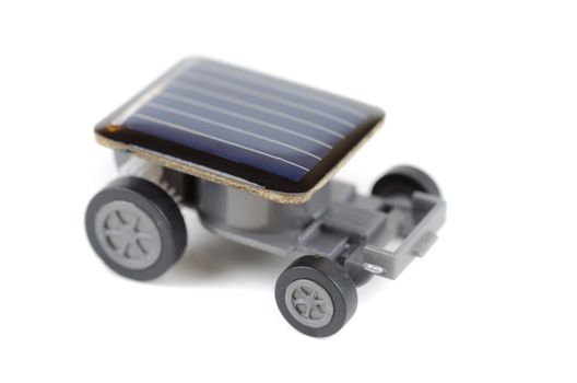Solar powered toy car on a white background. for concept.