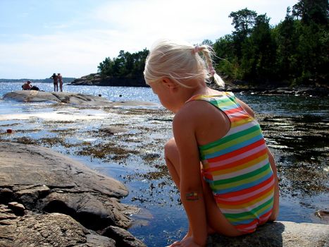 girl playing at the seaside. Please note: No negative use allowed.