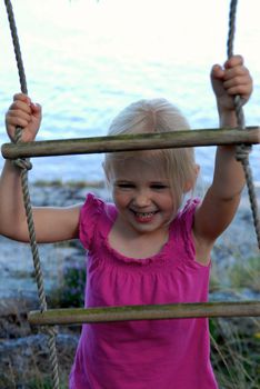 little girl climbing the ladder. Please note: No negative use allowed.