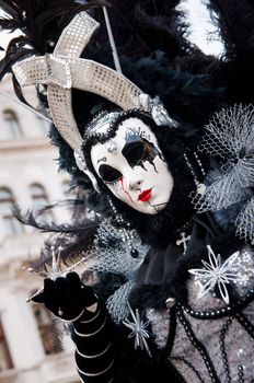 Traditional Venice Carnival mask in San Marco square Venice. Vertical view