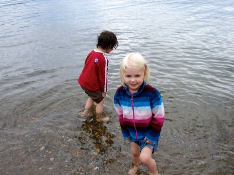 girls playing water at the seaside. Please note: No negative use allowed.