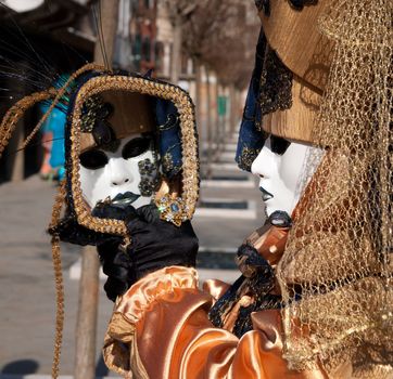 Traditional Venice Carnival mask in San Marco square Venice. Vertical view