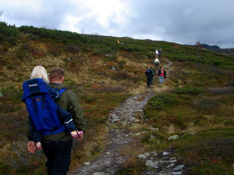 people hiking on the mountain. Please note: No negative use allowed.