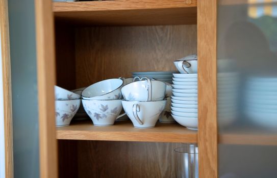 cups and dishes in the cabinet. Please note: No negative use allowed.