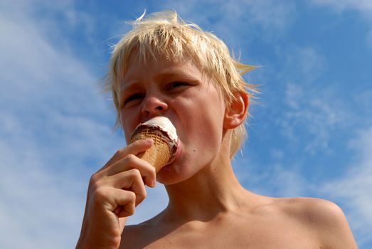 boy eating the ice cream. Please note: No negative use allowed.