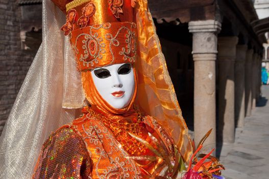 Traditional Venice Carnival mask in San Marco square Venice.