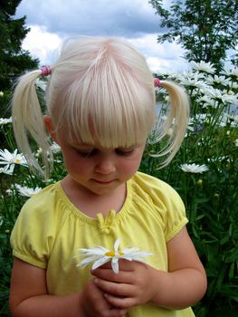 girl picking the flowers. Please note: No negative use allowed.