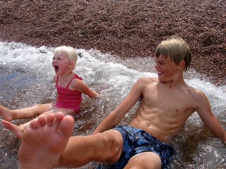 children having fun at the seaside. Please note: No negative use allowed.