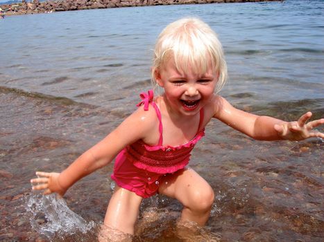 children having fun at the seaside. Please note: No negative use allowed.