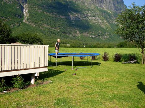 boy playing on the trampoline. Please note: No negative use allowed.