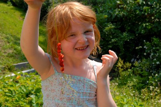 girl making the strawberry string. Please note: No negative use allowed.