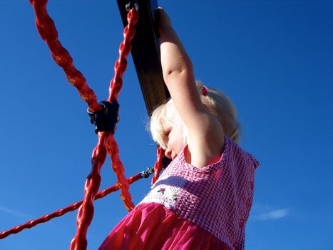 girl climbing on net. Please note: No negative use allowed.