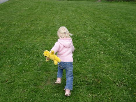 girl running in the garden. Please note: No negative use allowed.