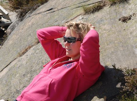 woman leisure on the rock. Please note: No negative use allowed.
