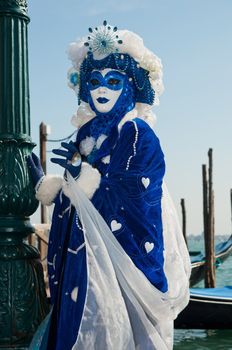 Traditional Venice Carnival mask in San Marco square Venice. Vertical view