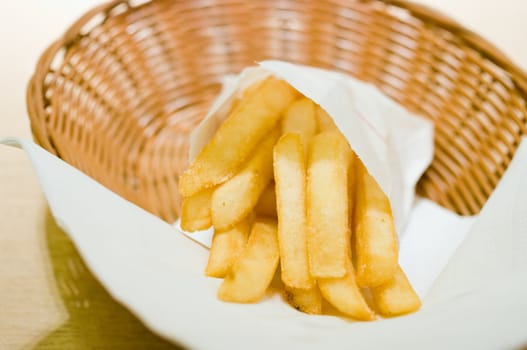 French fries in basket on the table