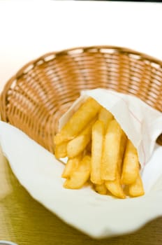 French fries in basket on the table