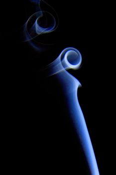 Abstract colored smoke isolated on black background