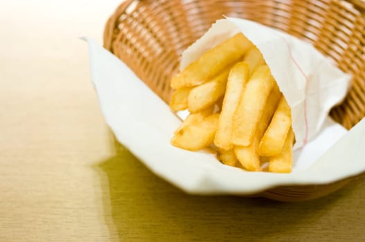 French fries in basket on the table