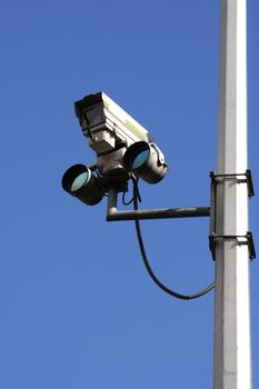 Traffic camera against blue sky
