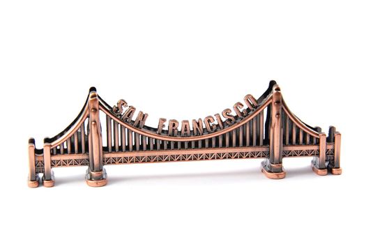 Small bronze copy of Golden Gate in San Francisco, isolated on white