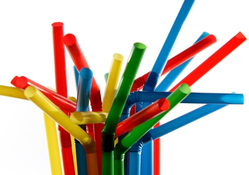 Colorful straws on white background 