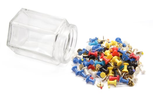 Colored Pushpins on white background