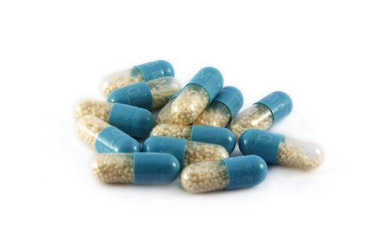 Batch of pills on white background 