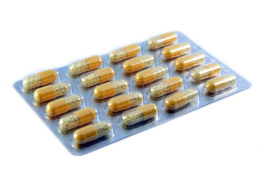 Package of pills in blister on white background 