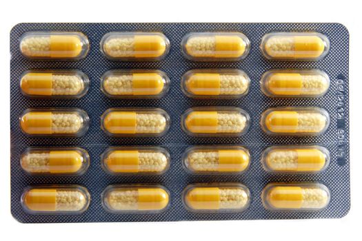 Package of pills in blister on white background 