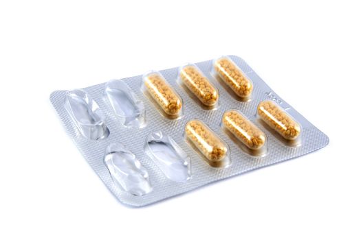 Package of pills in blister on white background 