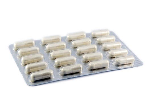 Package of pills in blister on white background 