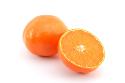 A cut mandarin orange isolated on white 