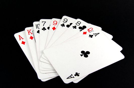 Playing cards on black background 