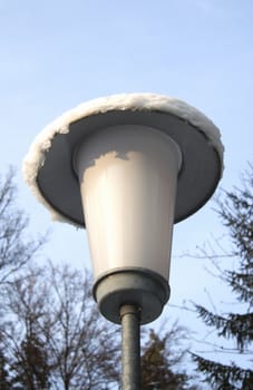 Street lamp against the blue sky 