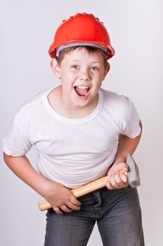 Portrait of a boy in a red protective helmet