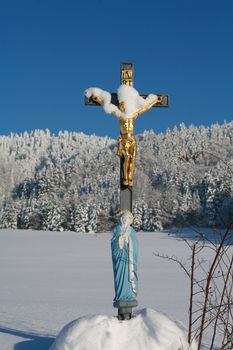 Cross in winterscene