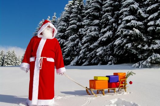 Santa Claus, Father Christmas with colorful presents on a sledge