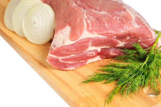 Piece of pork for roasting on a wooden board. Isolated on white.