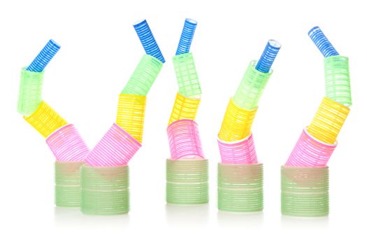 Multicolored hair curlers isolated over white background