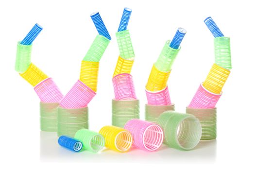Multicolored hair curlers isolated over white background