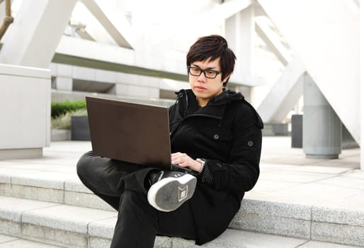 man using computer outdoor