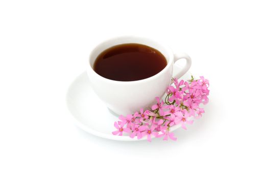 A cup of black coffee with flowers on a white background