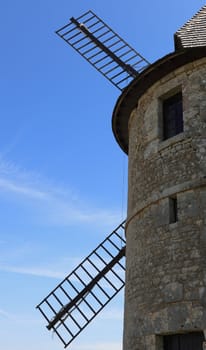 Close-up image of the upper part of a traditional windmill.