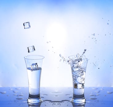water splash in glasse, white-blue background