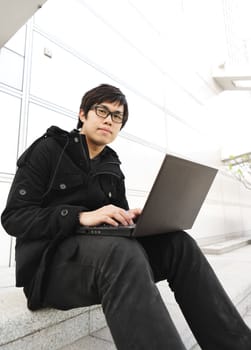 man using computer outdoor